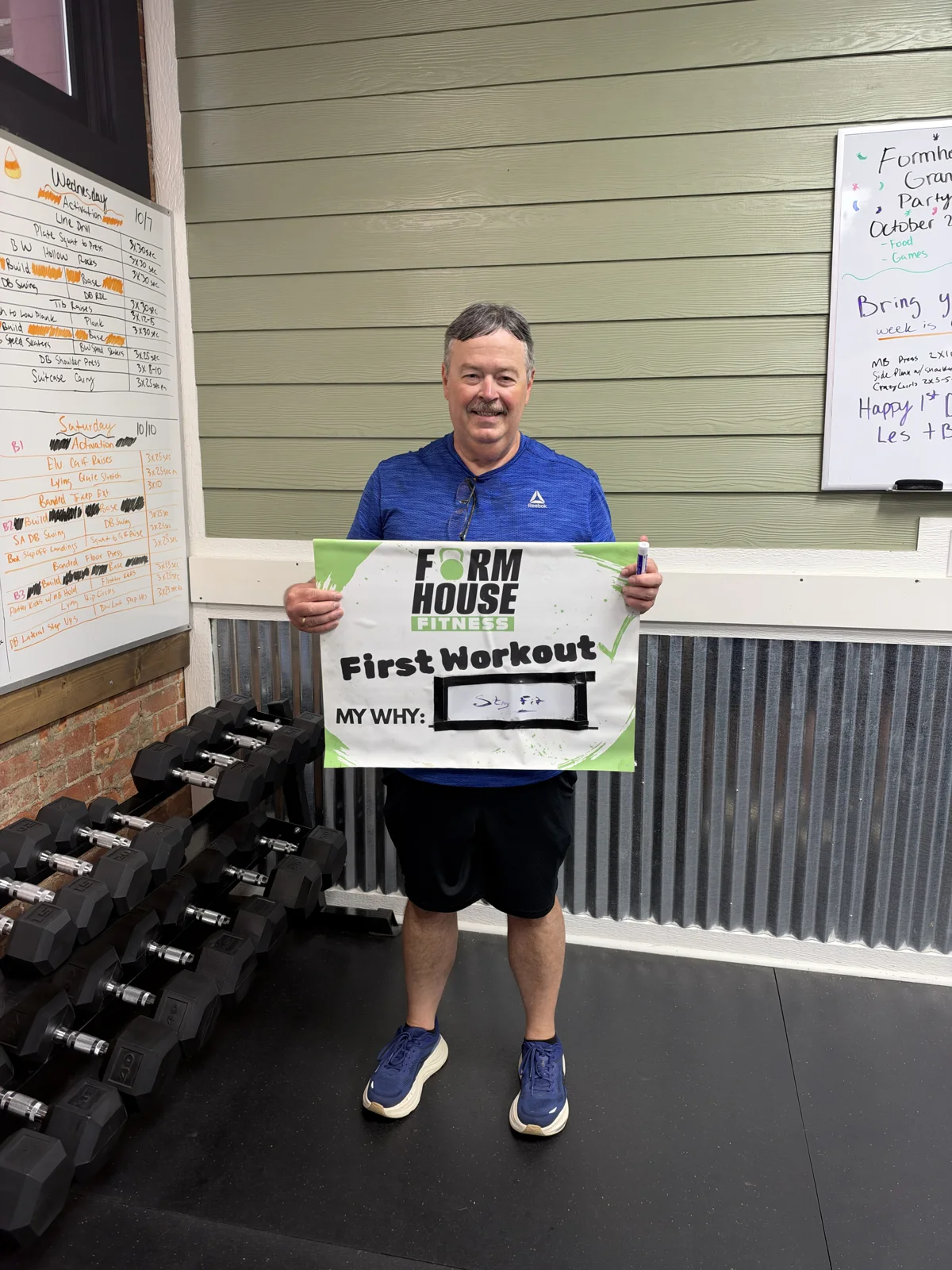 A Formhouse participant celebrating their first workout with a personal goal sign